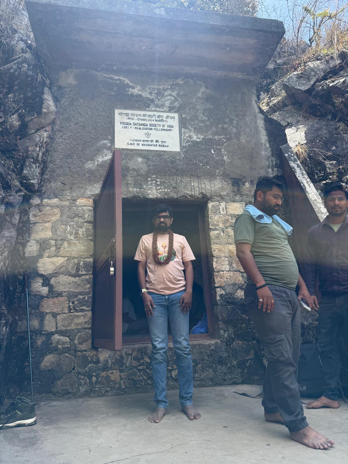 The entrance to Mahavatar Babaji's Cave at Kukuchina, Dunagiri. The sign reads "Yogoda Satsanga Society of India (Self-Realization Fellowship) — Cave of Mahavatar Babaji." (Photo: Author, taken during personal pilgrimage)